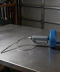 Heavy Duty Drain Cleaner Spring Coil Strip Multi Length Plumbing Snaker Flexible Pipe Breaker For Sink And Tub on metal surface.