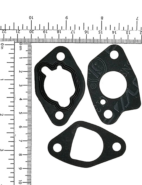 Gaskets for P19 Carburetor Kit With Built In Fuel Tap For Predator 212 and Honda GX Engines next to ruler for scale