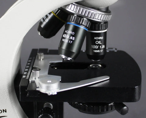 Close-up of Lab Workhorse Triocular Compound Microscope With 40x To 1000x Magnification LED Illumination stage and lenses