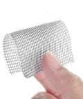 Close-up of fine mesh polyurethane screen repair tape in hand for window and door screens, part of the Polyurethane Screen Repair Tape With Fine Mesh Patch For Window And Door Screens Easy Cut Durable Black Adhesive Patch For Quick At Home Hacks For DIY Projects.