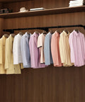 Wall Mounted Clothes Rack 72.5in Industrial Pipe Vibe Heavy Duty Detachable Iron Garment Bar in a wooden closet holding shirts