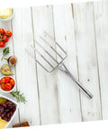 Heavy Duty Workhorse Garden Fork For Digging And Transplanting Beans Stainless Steel Hand Fork on wooden surface with vegetables