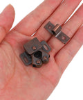 Hand holding Double Roller Cabinet Door Catches With Spring, Heavy Duty Iron Latches for Kitchen Cabinets and Furniture.