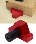 Non Slip Aluminum Bench Dog Clamp Pro Grade With Storage Case holding a wooden block in workshop setting