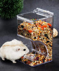 Clear Acrylic Automatic Pet Food Dispenser 300ml For Small Animals And Birds with hamster accessing food.