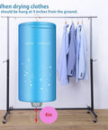 Blue Portable 900W Mini Electric Clothes Dryer Rack For Apartments And Travel Ready next to hanging shirts