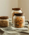 Premium Glass Coffee Canister With Secure Locking Lid Wide Mouth Kitchen Storage Jar For Beans Sugar Loose Tea Clear Airtight Food Container filled with pasta and dried herbs.