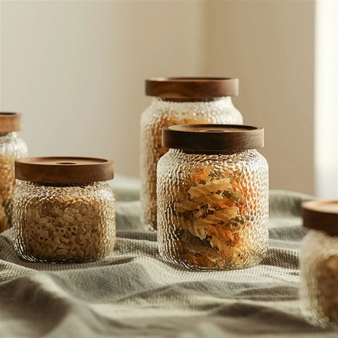 Premium Glass Coffee Canister With Secure Locking Lid Wide Mouth Kitchen Storage Jar For Beans Sugar Loose Tea Clear Airtight Food Container filled with pasta and dried herbs.