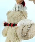 Close-up of a plush toy with 50 Pcs 4 Inch Ball Beads Chain With Connectors For DIY Hanging Decoration And Craft Projects Dog Tag Keychains In Gold Finish Made From Durable Metal With Uniform Beads And Easy Attachment For Versatile Craft Use And Long Lasting Quality
