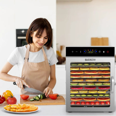 Top Shelf Heavy Duty Food Dehydrator With 12 Sleek Stainless Steel Trays on kitchen counter with sliced vegetables and fruits.
