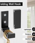 12 Piece Aluminum Alloy Folding Wall Hooks Heavy Duty Coat Hangers Foldable Rustproof Closet Organizer With Mounting Hardware For Coats Towels And Headphones showing a black wall hook mounted with a keyring.