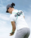 Rear view of golfer using TPro Green 2.0 Golf Swing Training Aid With Heavy Resistance And Coach Crafted Drills outdoors