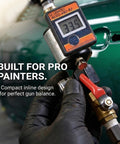 Hand holding Pro Grade Digital Air Regulator With Water Separator And Moisture Trap Inline Dryer against green background