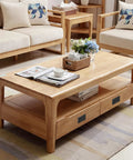 Wooden coffee table with storage drawers in a cozy living room setting with sofas and decorations.