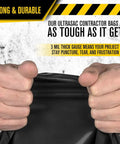 Hands gripping heavy duty contractor bag showcasing durability for commercial debris use. Heavy Duty Contractor Bags In A Tough 50 Pack With Rip Resistant Drawstrings At 42 Gallon Size And 3 Mil Gauge For Brutal Trade Debris And Commercial Dumpster Runs.