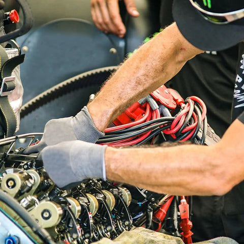Mechanic installing Five Sixteenth Inch Fuel Line Hose For Cars And Trucks, SAE 30R10, Five Feet Long, High Pressure NBR Rubber