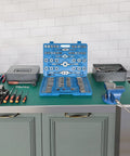 Heavy Duty Metric Tap and Die Set M2 to M18 With Case and Full Accessories displayed on a workbench in a home shop setting.
