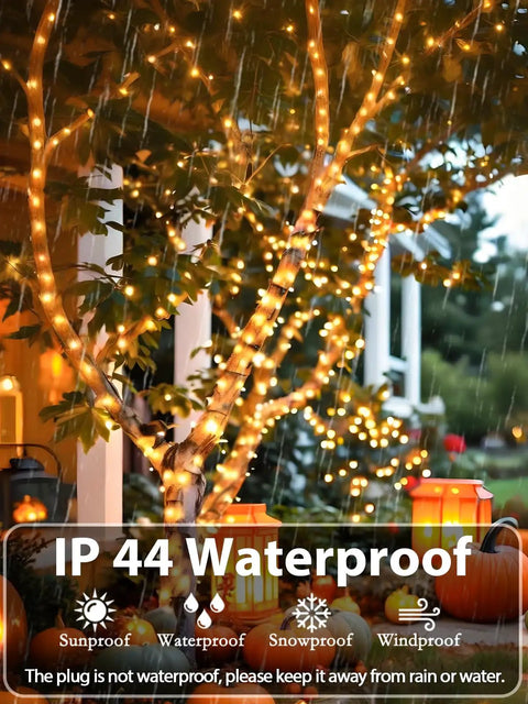 Lit 75.8 Ft 200 LED Christmas String Lights For Indoor And Outdoor Use With Timer And Memory Function on a tree, waterproof in rain.