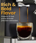 CafeMaster Pro Espresso Machine Lets You Brew Single Or Double Shots Like A Real Barista At Home With Built In Milk Frother 15 Bar Pump XL 1.8 Liter Removable Water Reservoir Stainless Steel Finish dispensing espresso into a glass cup