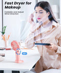 Woman using 3 In 1 Portable Personal Fan With 4000mAh Battery And LED Display Handheld Or Neck Or Desk Use 90 Degree Foldable Base