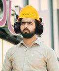 Beefed Up Heavy Duty Safety Hard Hat Earmuffs With Zero Hassle Adjustable Fit And Deep Noise Cancelling Seals For Crews Knocking Out Loud Job Site Projects worn by man in yellow hard hat.