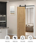 Beefy 3.5 Ft Bi Folding Sliding Barn Door Hardware Kit installed on doorway with wooden door panel, black finish