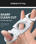 Roygra 3-pack stainless steel guillotine cigar cutter; fits most cigar sizes; held in hand.