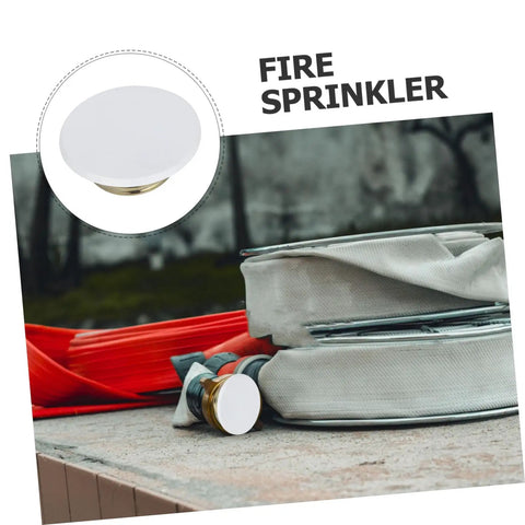 Concealed Fire Sprinkler Cover Plate And Ceiling Escutcheon featuring a snug fit, white finish, on a fire hose setup.