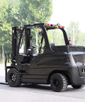 Mini Electric Forklift Pallet Stacker With Adjustable Reinforced Forks And Solid Tires For Indoor Warehouses, black, side view.