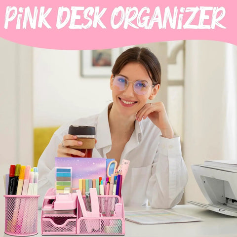 Smiling person at desk with a pink organizer filled with pens, scissors, and sticky notes, labeled 'Pink Desk Organizer'.