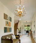 Three Light K9 Crystal Pendant Chandelier In Gold, in living room with modern decor, 39 inch adjustable cord