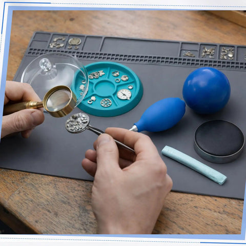 All In One Six Piece Watch Cleaning Kit With Putty And Dust Cover Air Blaster Cushion Case Opener Ball Repair Mat And Pivot Tool shown
