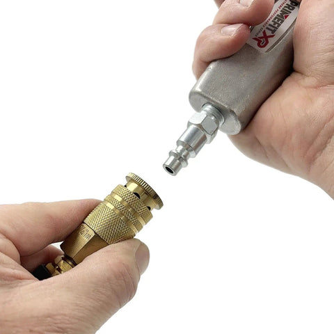 Connecting a Six Ball Brass Female Industrial Coupler 1/4 Inch With Nitrile Seals to an air tool, showcasing corrosion resistance