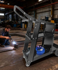 Heavy Duty 3 Tier Rolling Welder Cart With Tank Storage And Gas Cylinder Slots in workshop, black sturdy metal frame, 220 lb capacity.
