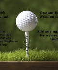 White Wooden Golf Tees 100 Pack 2 And 3 Quarter Inch Customizable Two Line Personalization Durable Bulk Golf Tees For Men And Women Perfect Gift And Practice Tee Set For Any Golfer, golf ball on engraved tee in grass