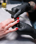 Manicure with Dual Use Nail File And Dead Skin Fork 6.29 Inch Stainless Steel Nail Cuticle Trimmer in use at salon
