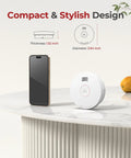 Top Shelf Smoke Detectors With Ten Year Sealed Lithium Battery on table beside smartphone, showing compact design and dimensions.