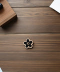 Total Fashion Hack With These Pocket Ready Black Flower Button Covers And Alloy Brooch Pins For Dresses No Sew Snap Fasteners displayed on wood