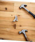 Rugged As Nails Scaffolding Locking Pins Made From Heavy Duty Steel Q235 set on wooden floor with hammers, showcasing their use.