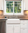 Modern kitchen with white cabinets and stainless steel appliances, featuring 30 Pack 4 Inch Brushed Nickel Cabinet Pulls Square Handles