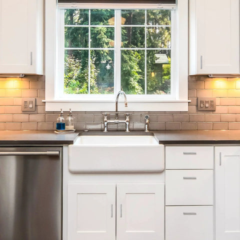 Modern kitchen with white cabinets and stainless steel appliances, featuring 30 Pack 4 Inch Brushed Nickel Cabinet Pulls Square Handles