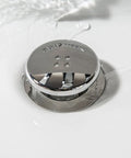 The Real Deal Drain Protector And Hair Catcher Combo For Bathtubs And Sinks Chrome Finish, sleek chrome drain stopper in water.