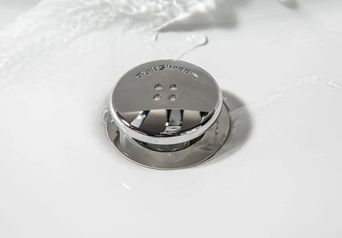 The Real Deal Drain Protector And Hair Catcher Combo For Bathtubs And Sinks Chrome Finish, sleek chrome drain stopper in water.