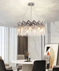 Dope Modern K9 Crystal Chandelier With Nine Lights Raindrop Pendant Ceiling Light Chrome Finish in a dining room setting