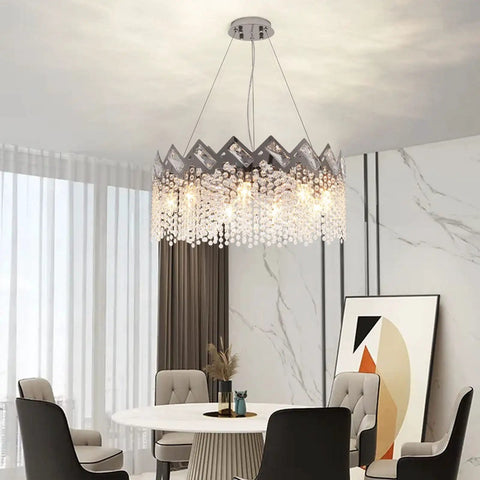 Dope Modern K9 Crystal Chandelier With Nine Lights Raindrop Pendant Ceiling Light Chrome Finish in a dining room setting