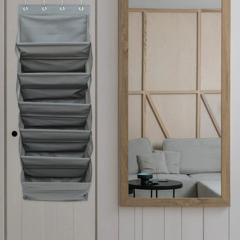 Straight Up Game Changer Over The Door Shoe Rack With Six Roomy Pockets hanging on door with modern decor and couch in background.