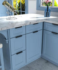 Modern kitchen with blue cabinets featuring 25 Pack Finger Edge Pulls For Black Cabinet Handles And Drawer Pulls, 5 Inch Hole Centers.