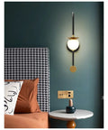 Smooth Matte Iron Wall Lamp Serving Prime Glareless Bedside Reading Glow With Quick Three Color Toggle in stylish bedroom setup.