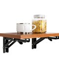 Heavy Duty Folding Shelf Brackets 16 Inch Collapsible Wall Mount with wooden shelf, cup, and jar for space-saving setup.