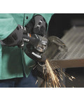 User operating the No Nonsense 4 1/2 Inch Air Angle Grinder Cranking 12000 RPM on metal with sparks flying.